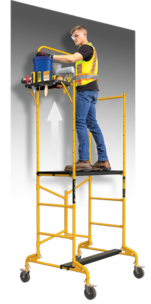 A picture showing a user standing on the platform at its highest setting and the handrail extended. The foldable tool shelf is loaded with painting supplies.